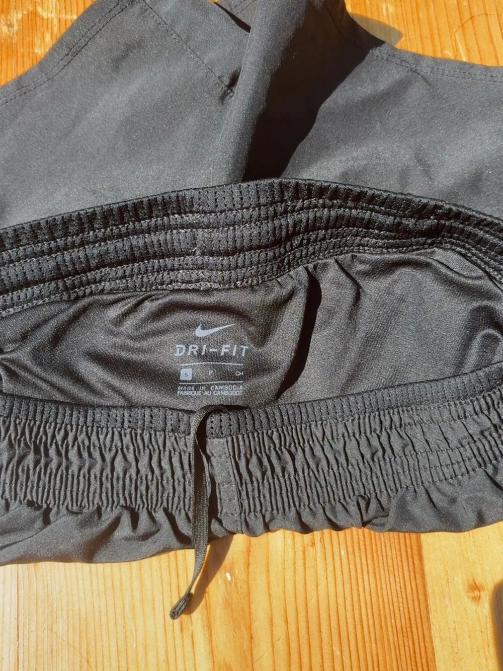 Nike Women’s Black Athletic Shorts with White Swoosh